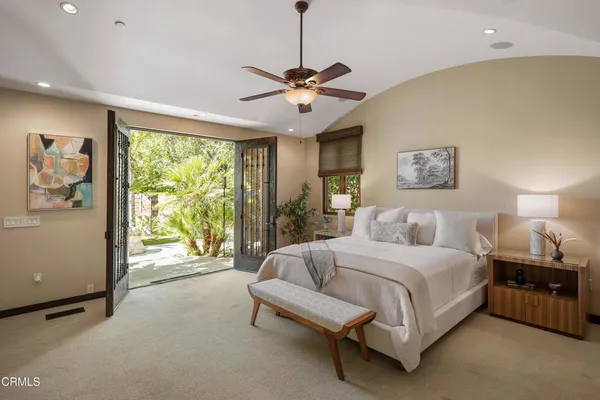 a view of backyard with swimming pool and outdoor seating