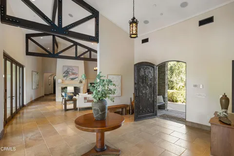 a living room with fireplace furniture and a fireplace