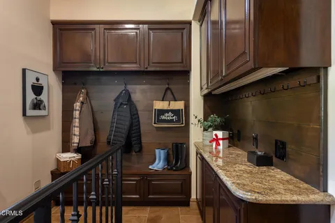 a balcony with table and chairs