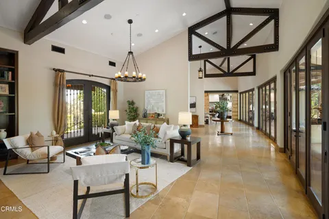 a large kitchen with a table and chairs