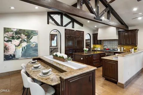 a living room with fireplace furniture and a fireplace
