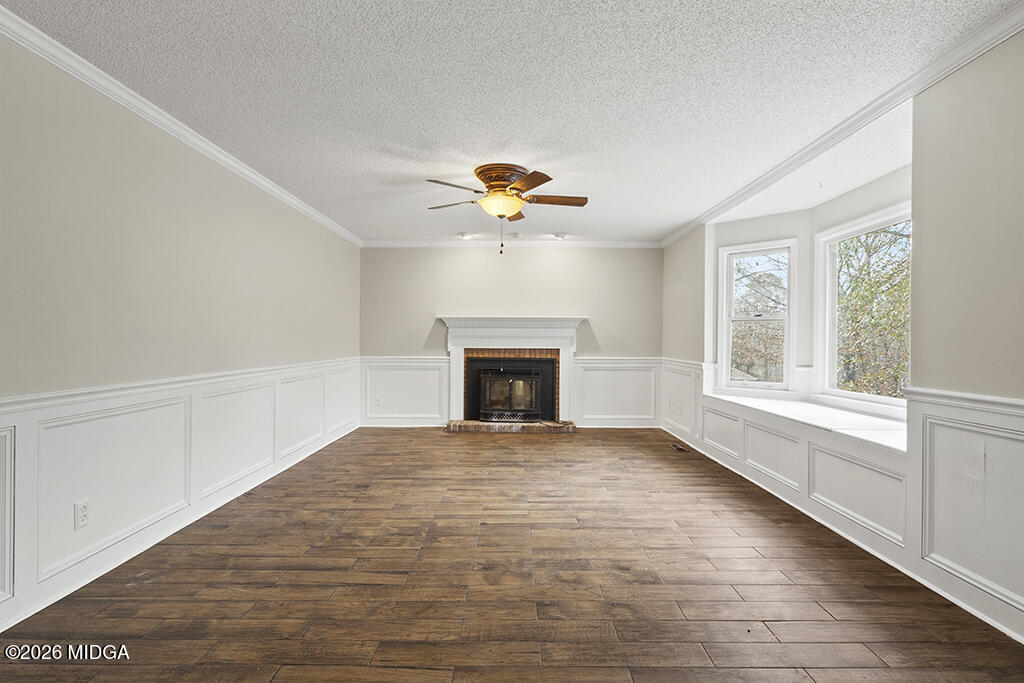 407 Smoke Rise Drive Warner Robins, GA 31088 - Photo 23 of 34 a view of an empty room with a fireplace and a window