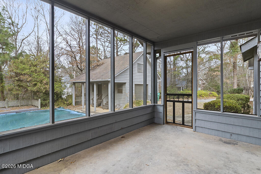 407 Smoke Rise Drive Warner Robins, GA 31088 - Photo 24 of 34 a view of empty room with balcony and floor to ceiling window