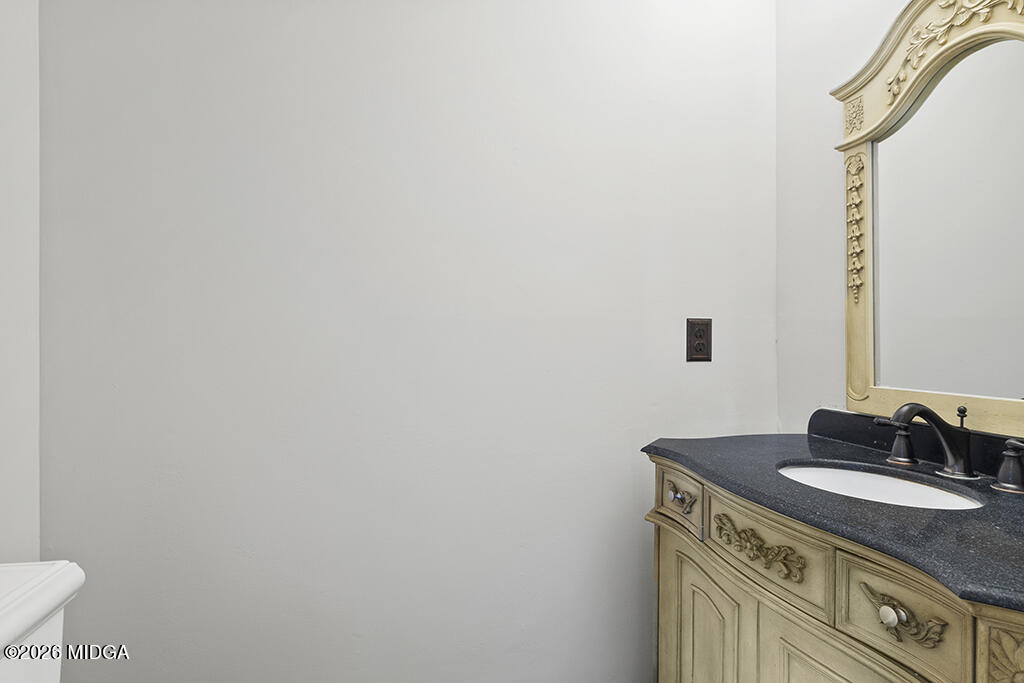 407 Smoke Rise Drive Warner Robins, GA 31088 - Photo 25 of 34 a sink and a mirror
