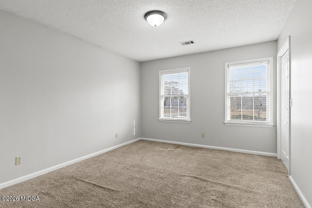 407 Smoke Rise Drive Warner Robins, GA 31088 - Photo 26 of 34 an empty room with windows