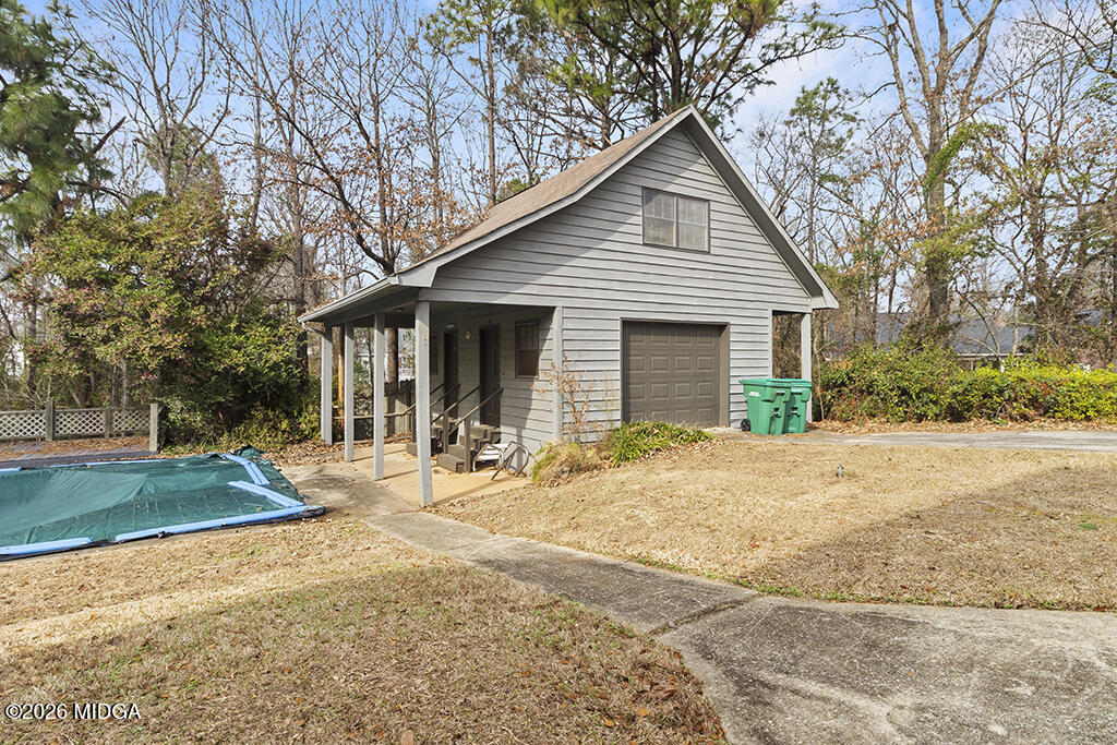 407 Smoke Rise Drive Warner Robins, GA 31088 - Photo 7 of 34 a front view of a house with a yard and garage
