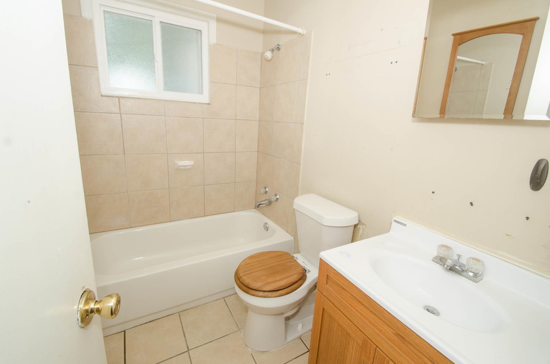 4932 Fairley Road Memphis, TN 38109 - Photo 9 of 10 a bathroom with a sink a toilet and shower