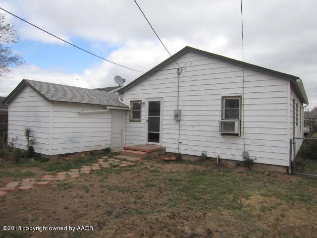4112 South Ong Street Amarillo, TX 79110 - Photo 4 of 16 a view of a house with a yard