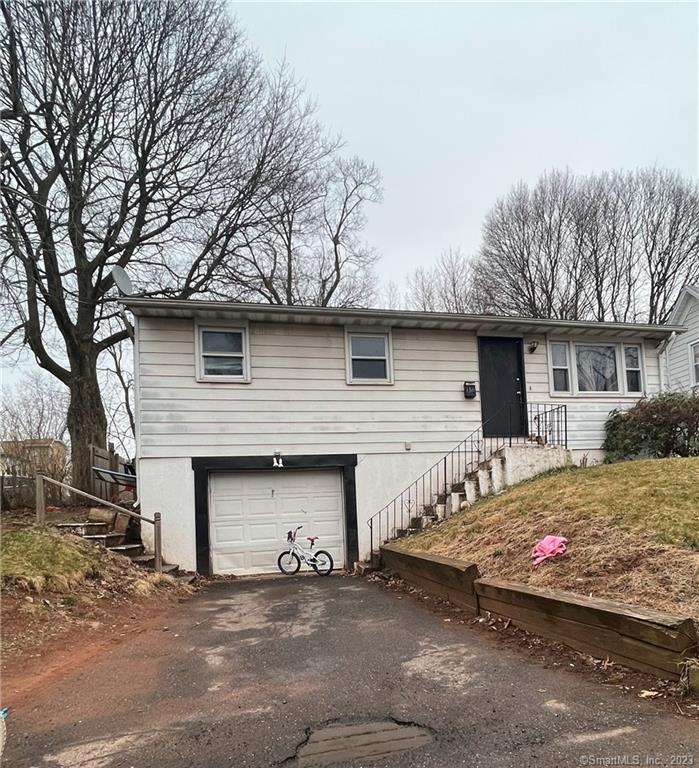 150 View Street Meriden, CT 06450 - Photo 1 of 1 a front view of a house with garage
