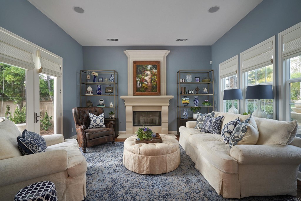 3566 Calle Palmito Carlsbad, CA 92009 - Photo 11 of 40 a living room with furniture and a fireplace