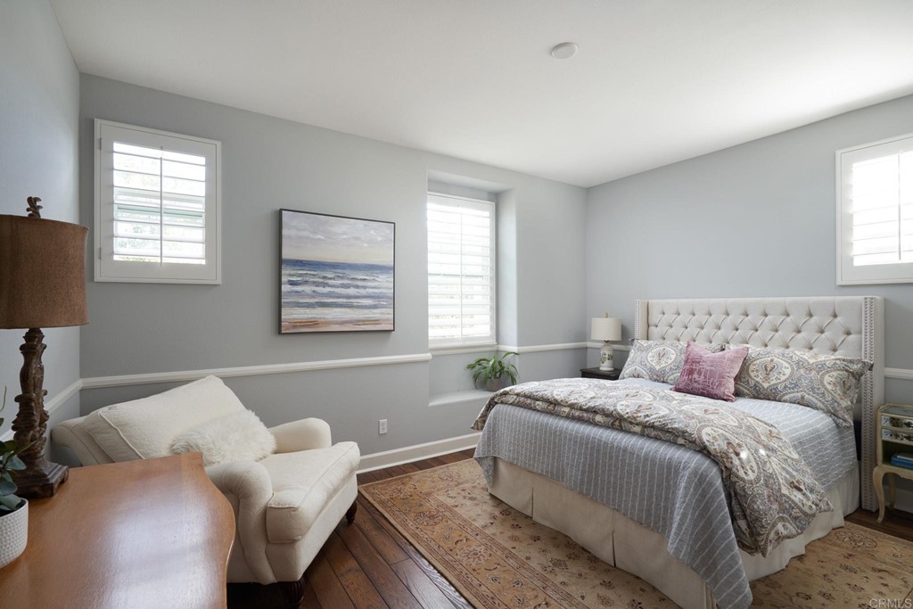3566 Calle Palmito Carlsbad, CA 92009 - Photo 23 of 40 a bed room with a bed and a couch