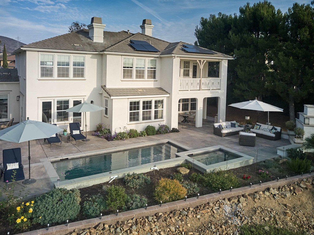 3566 Calle Palmito Carlsbad, CA 92009 - Photo 30 of 40 a front view of a house with yard and green space