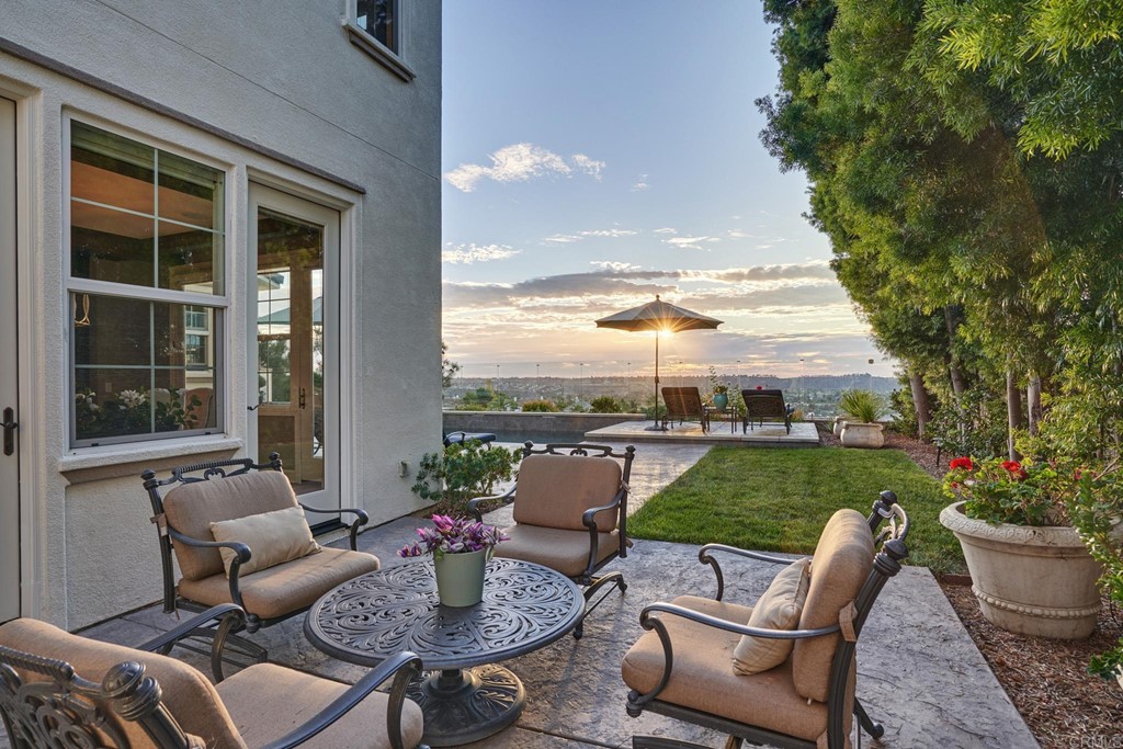 3566 Calle Palmito Carlsbad, CA 92009 - Photo 33 of 40 a patio with patio a couch and chairs