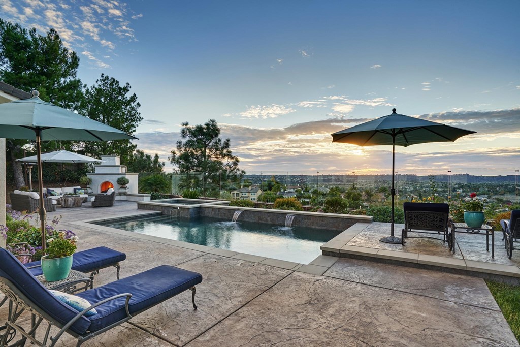 3566 Calle Palmito Carlsbad, CA 92009 - Photo 34 of 40 a view of a patio with swimming pool table and chairs