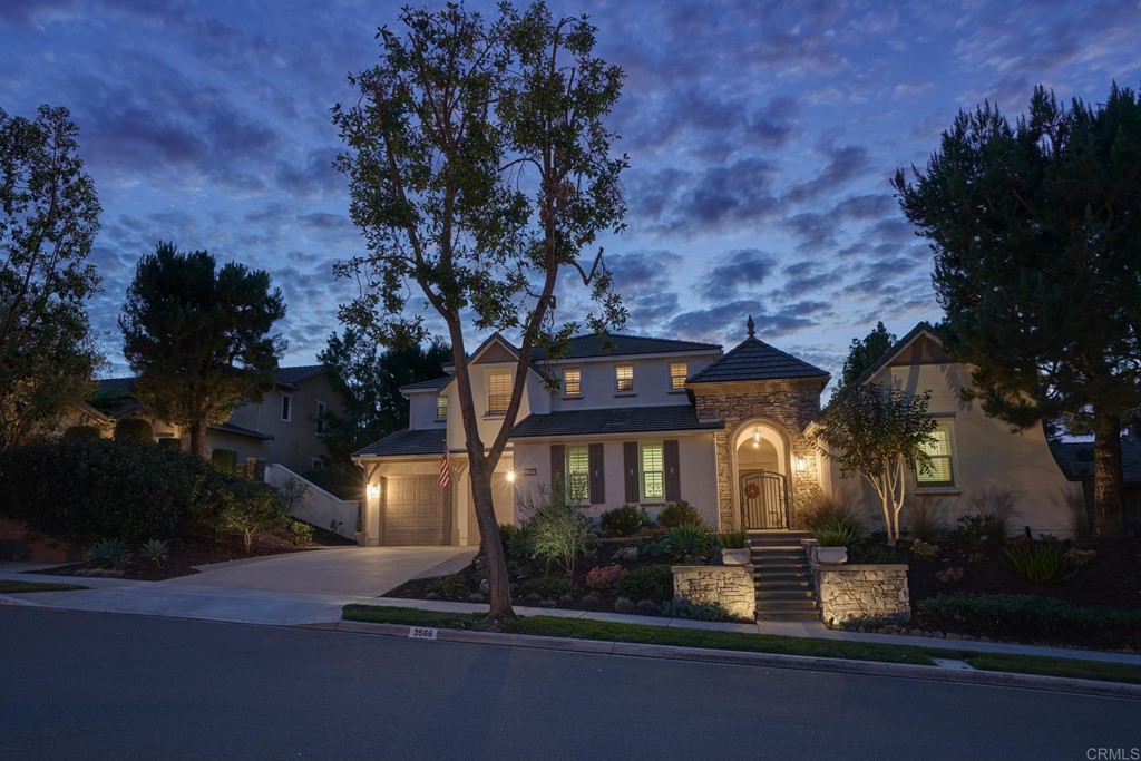 3566 Calle Palmito Carlsbad, CA 92009 - Photo 38 of 40 a front view of a house with a yard