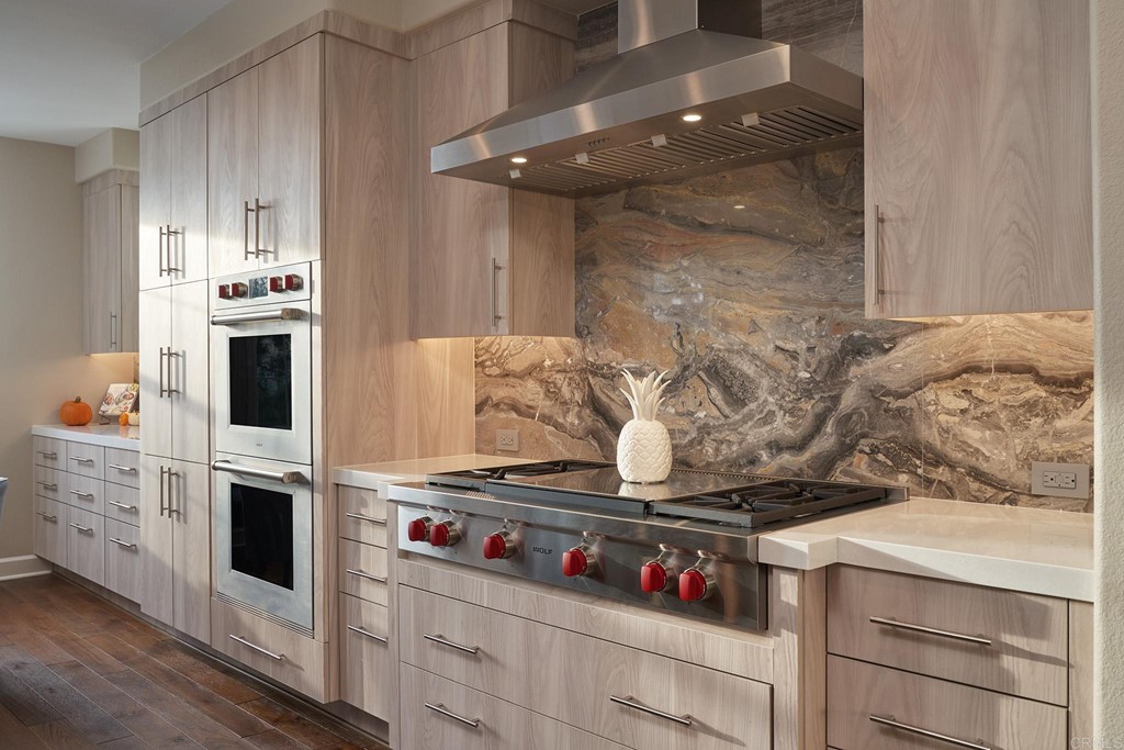 3566 Calle Palmito Carlsbad, CA 92009 - Photo 5 of 40 a kitchen with white cabinets and appliances
