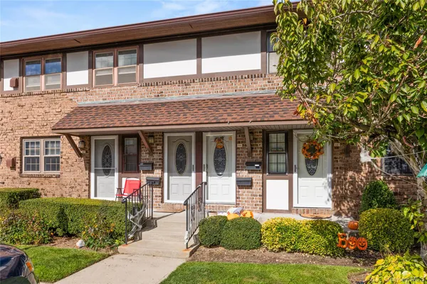 front view of a house with a small yard