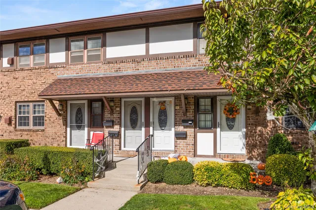 front view of a house with a small yard