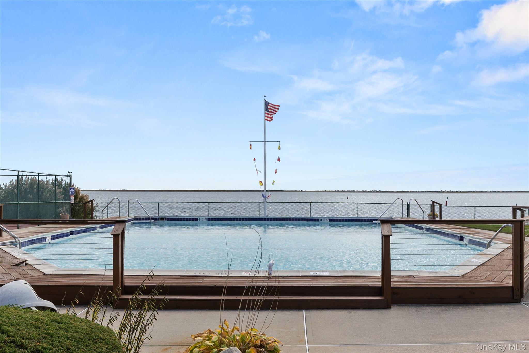 441 Mariners Way Copiague, NY 11726 - Photo 15 of 15 a view of a terrace with wooden floor and bridge