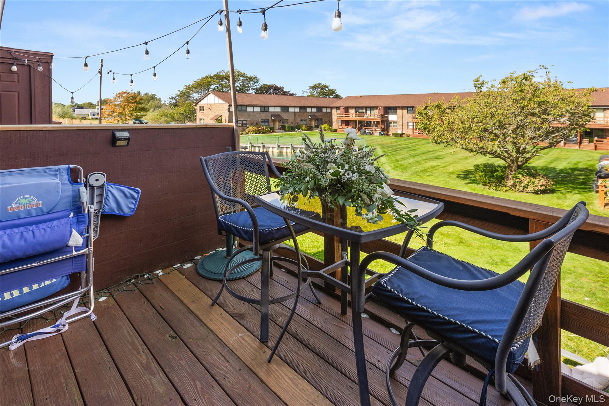 441 Mariners Way Copiague, NY 11726 - Photo 8 of 15 a view of a chairs and table on the wooden floor