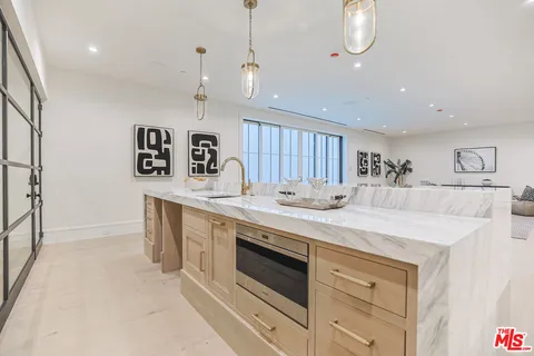 a kitchen with a stove and a sink