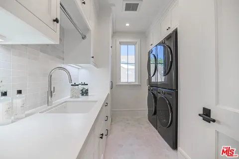 a bathroom with a sink and mirror