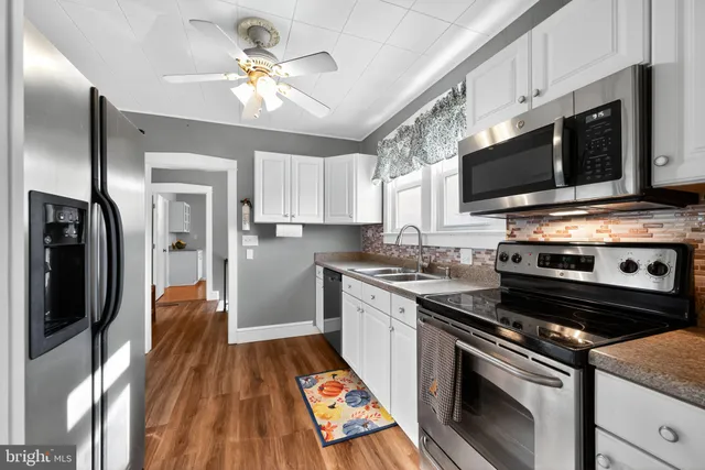 a kitchen with a stove and a microwave