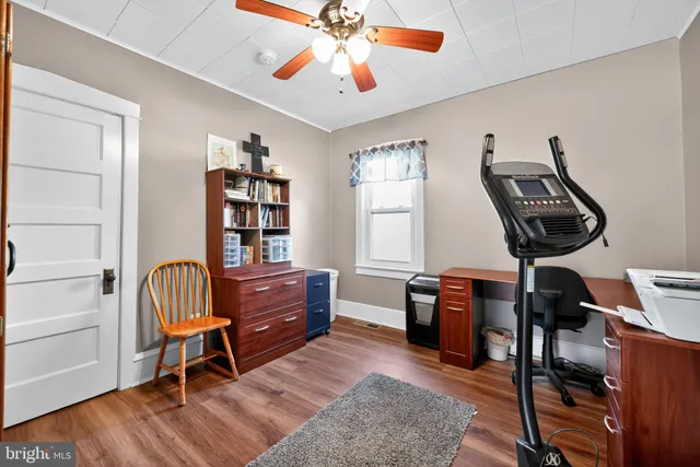 a bedroom with a workspace