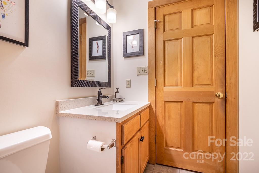 7224 Price Point Denver, NC 28037 - Photo 11 of 31 a bathroom with a sink a toilet and a mirror