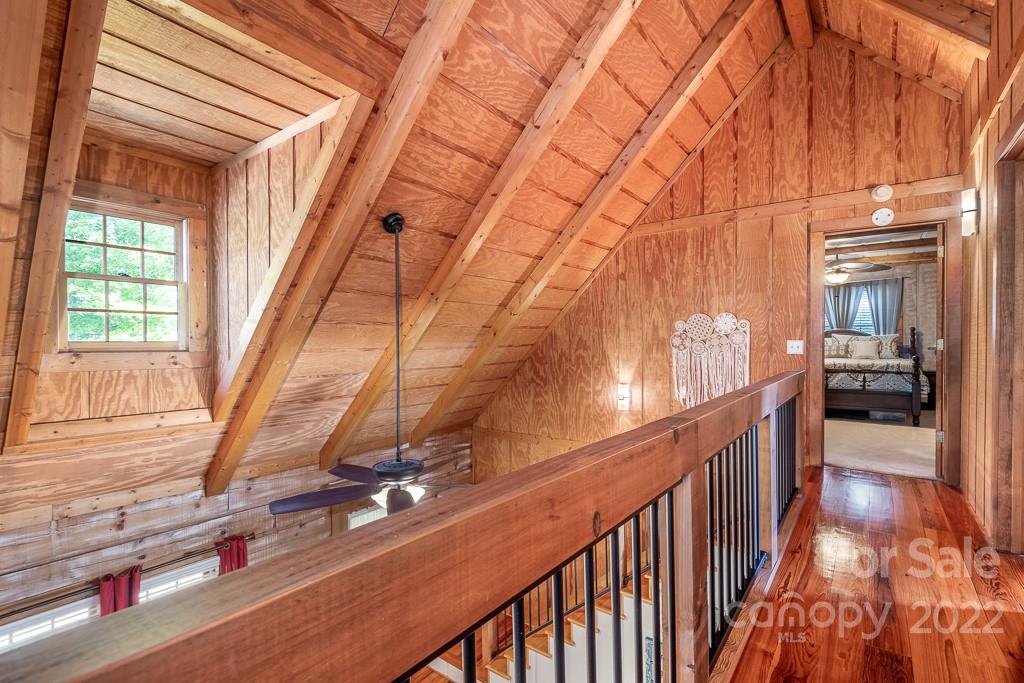 7224 Price Point Denver, NC 28037 - Photo 14 of 31 a view of a hallway with wooden floor and staircase