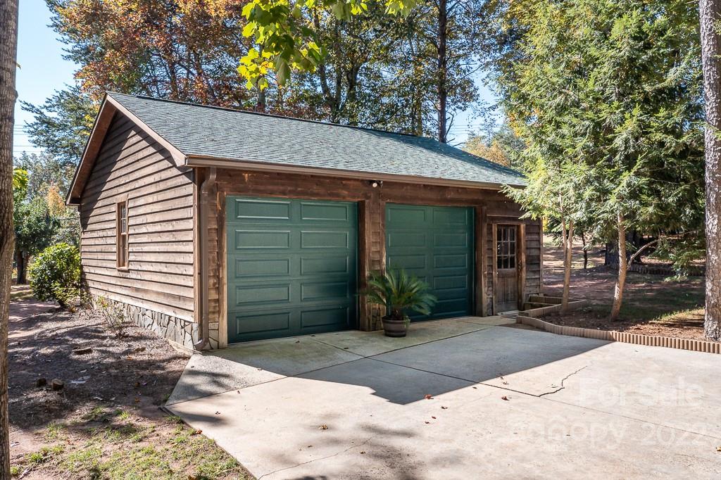 7224 Price Point Denver, NC 28037 - Photo 20 of 31 a view of a house with a yard plants and large tree