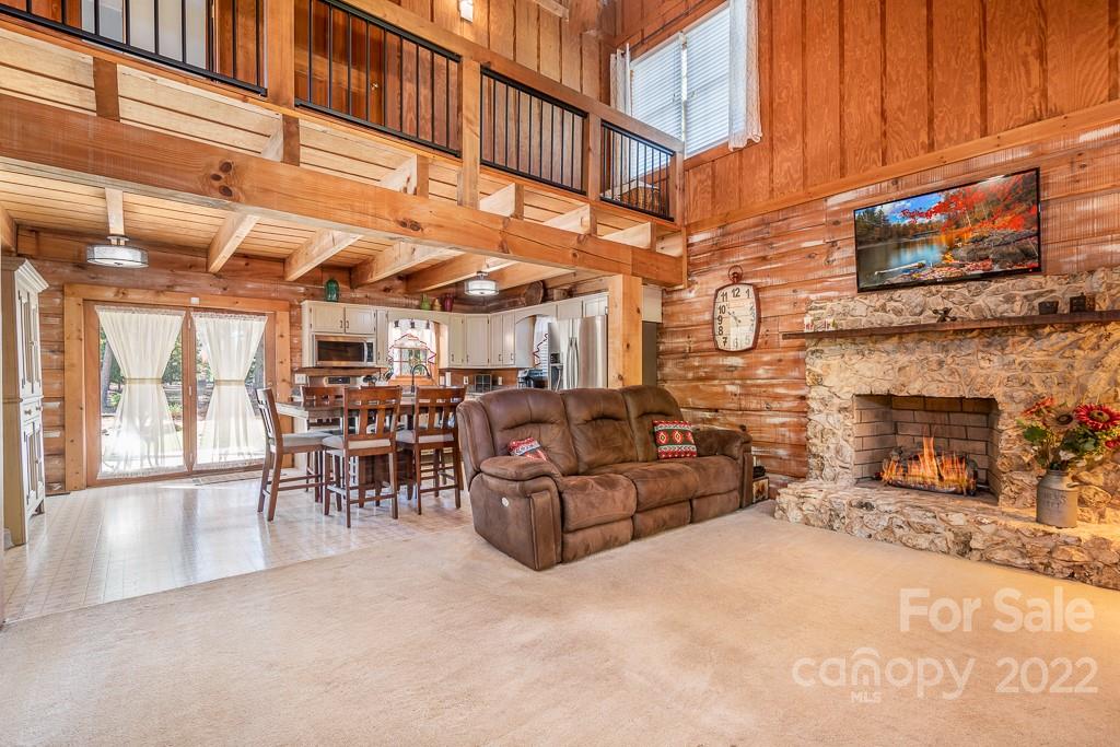 7224 Price Point Denver, NC 28037 - Photo 2 of 31 a living room with furniture a fireplace and a building