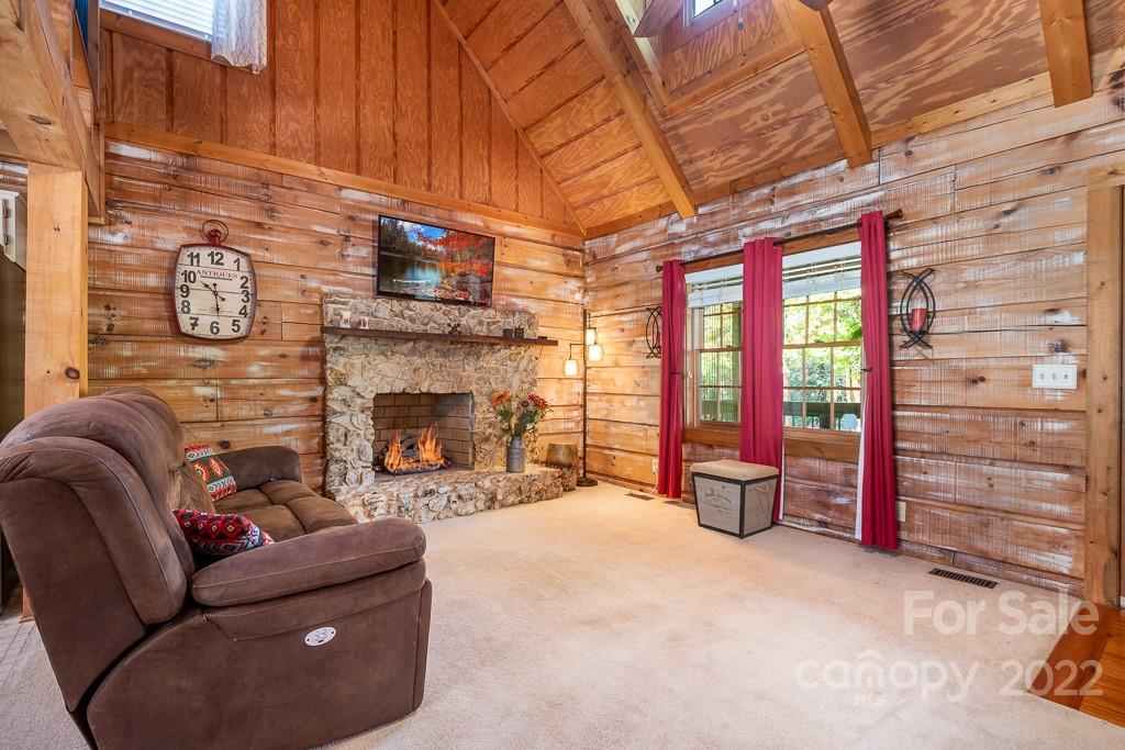 7224 Price Point Denver, NC 28037 - Photo 7 of 31 a living room with furniture a flat screen tv and a fireplace