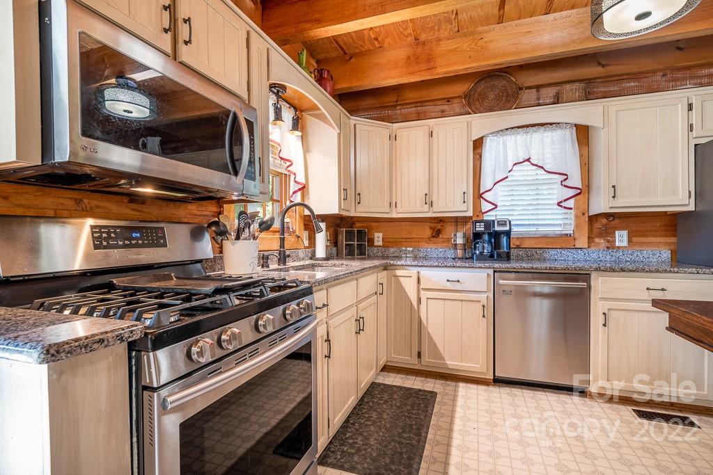 7224 Price Point Denver, NC 28037 - Photo 8 of 31 a kitchen with stainless steel appliances granite countertop a stove and a microwave