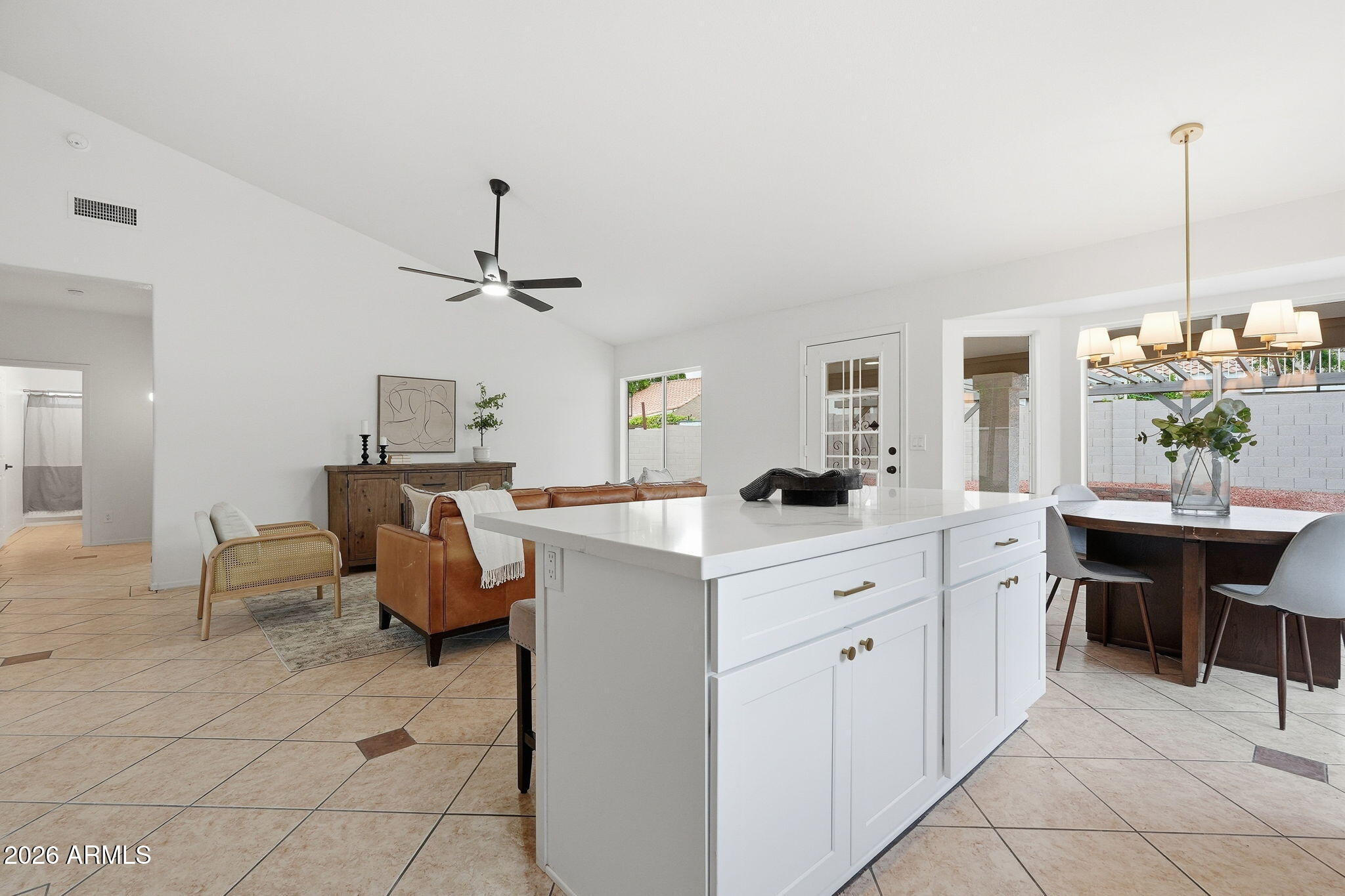7756 West Hearn Road Peoria, AZ 85381 - Photo 16 of 41 a large white kitchen with cabinets