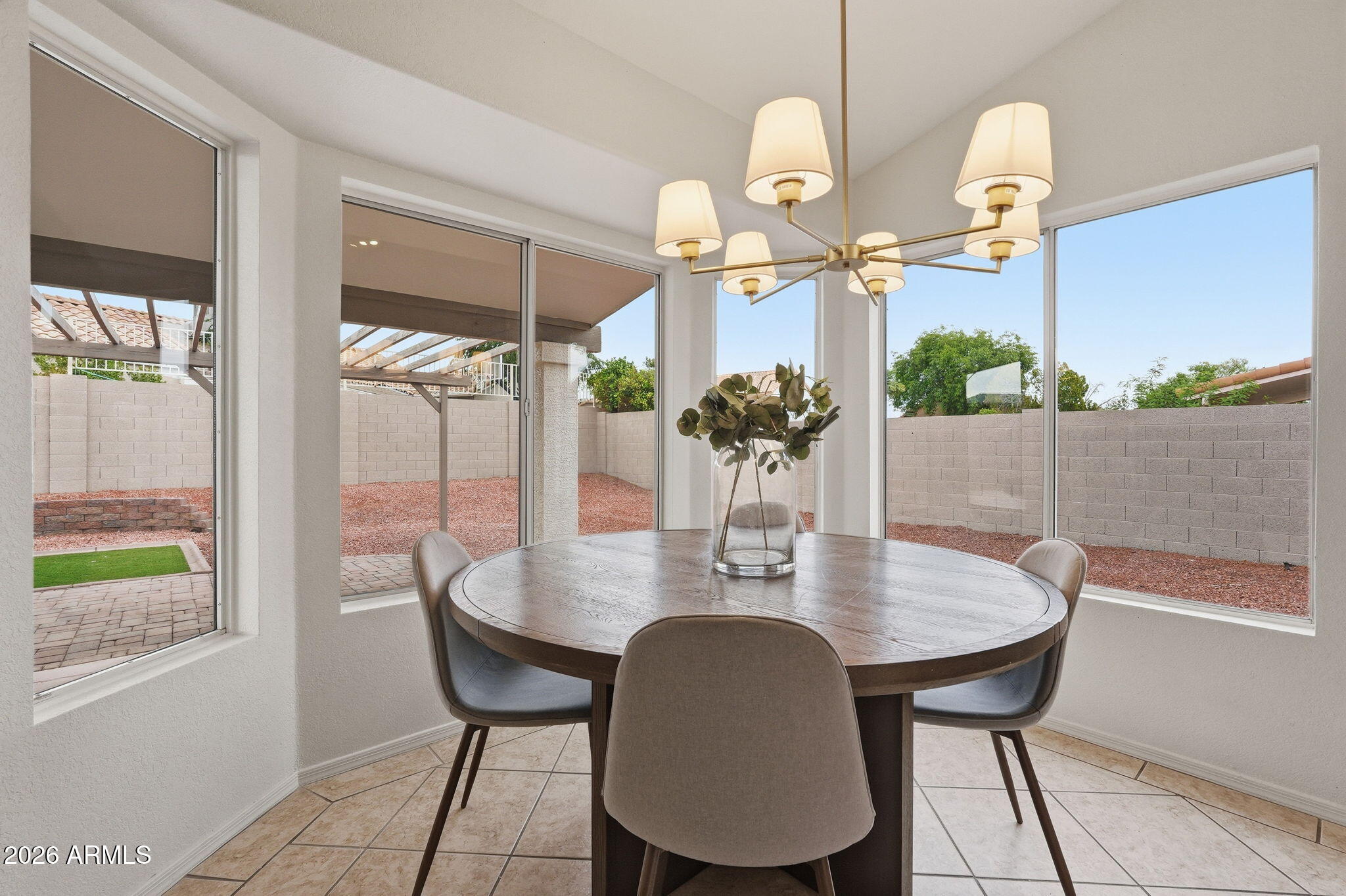 7756 West Hearn Road Peoria, AZ 85381 - Photo 19 of 41 a dining room with furniture and window