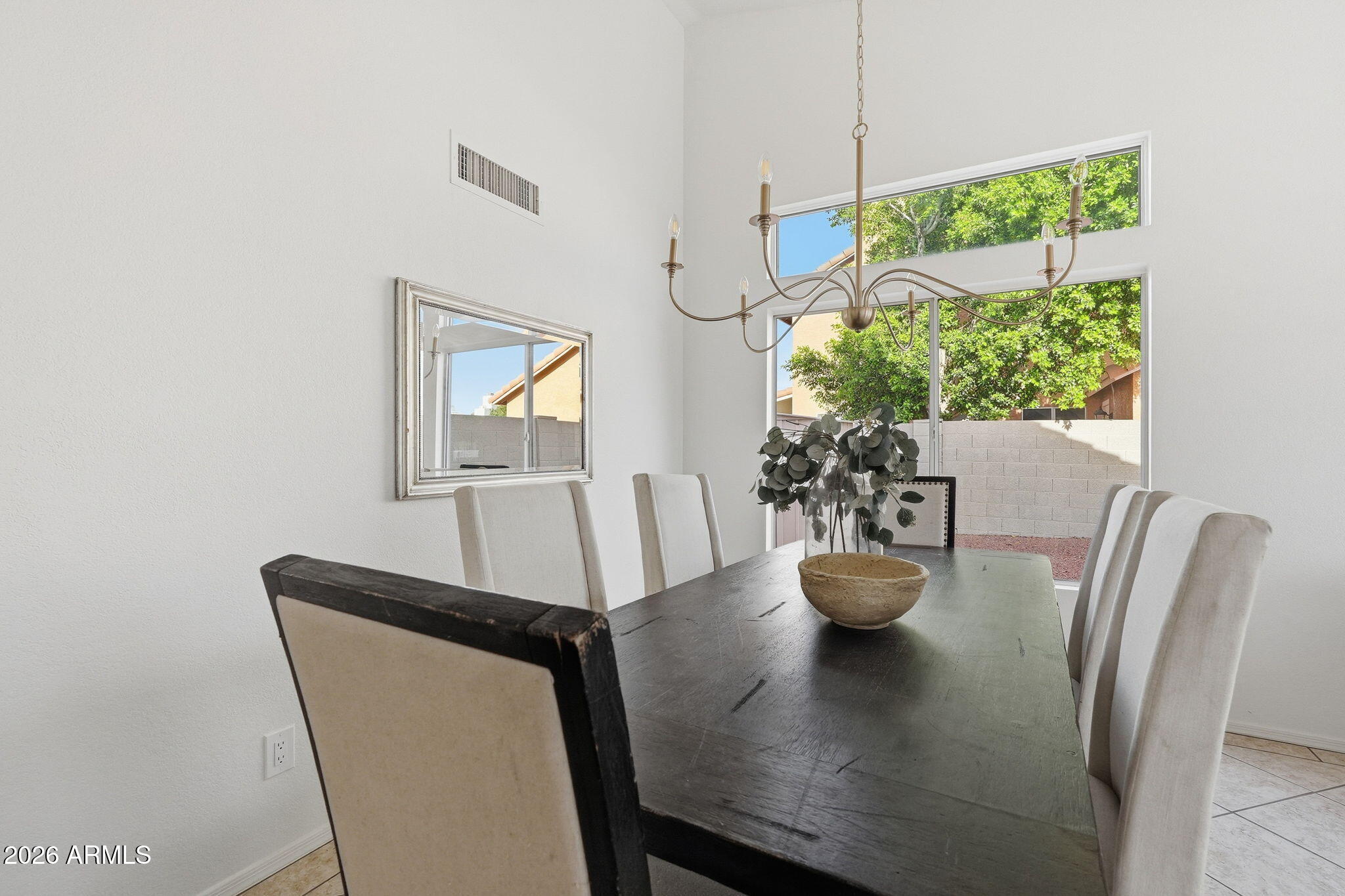 7756 West Hearn Road Peoria, AZ 85381 - Photo 21 of 41 a view of a dining room with furniture window and outside view