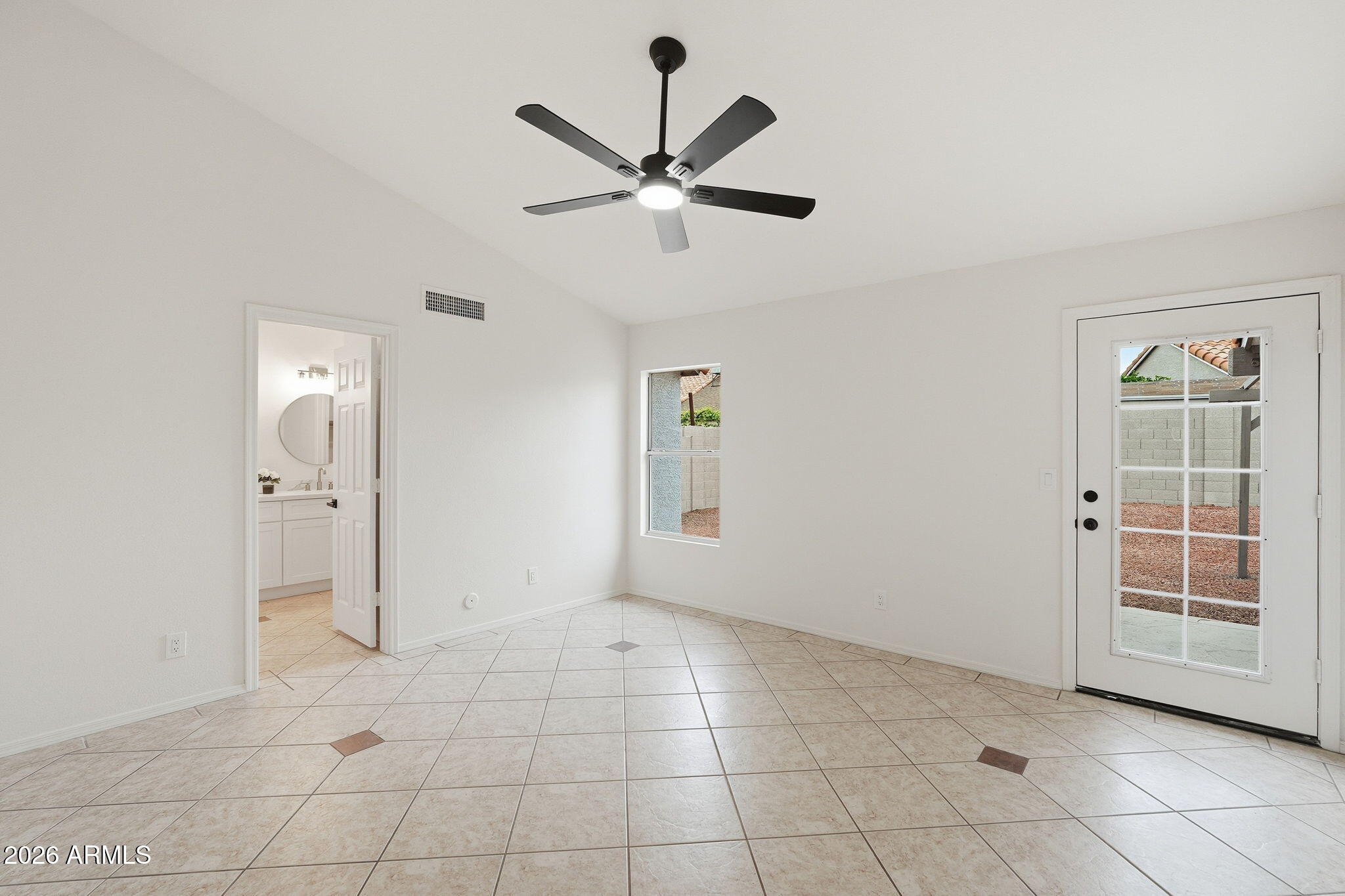 7756 West Hearn Road Peoria, AZ 85381 - Photo 22 of 41 a view of an empty room with a window
