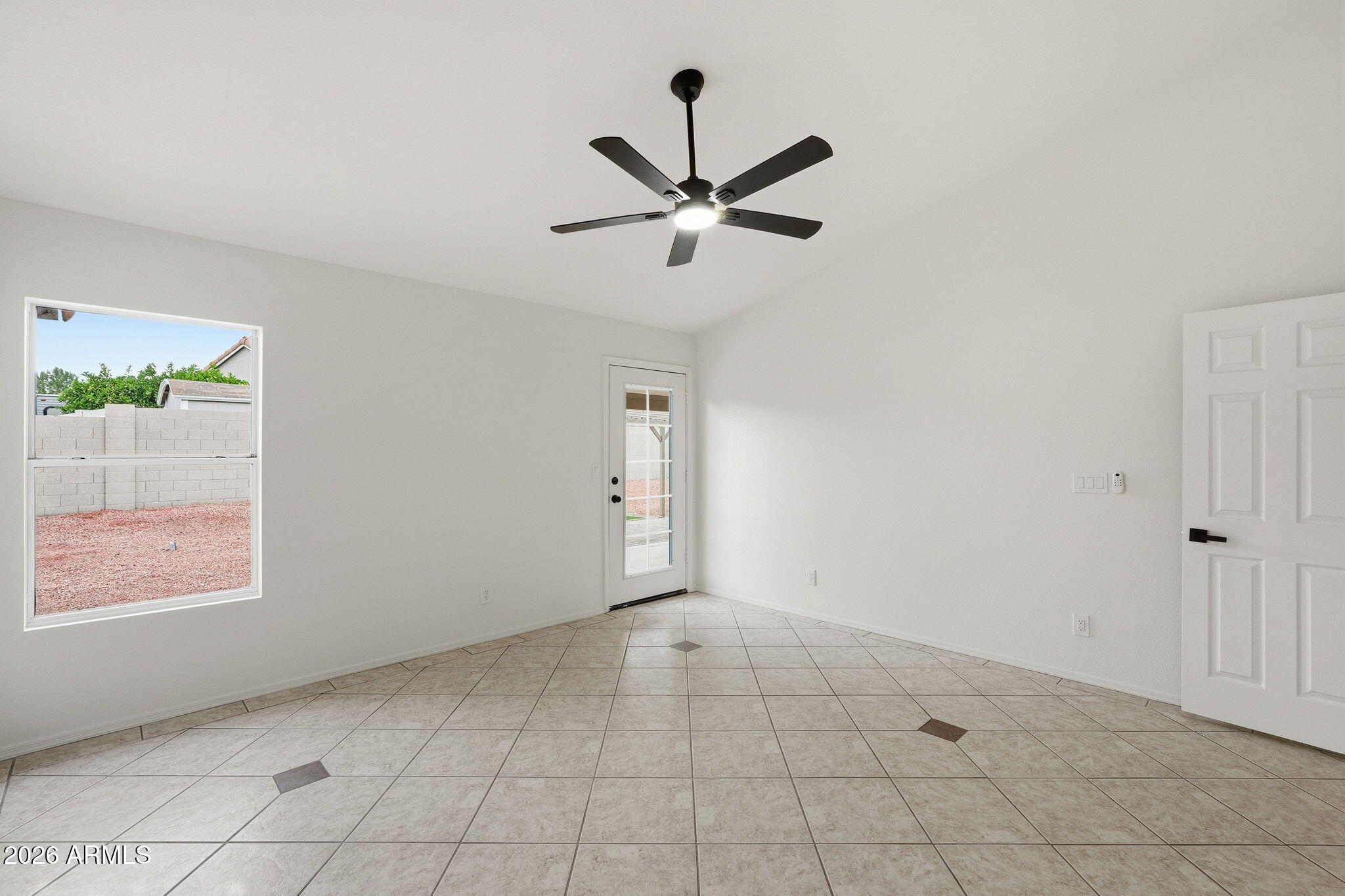 7756 West Hearn Road Peoria, AZ 85381 - Photo 23 of 41 an empty room with fan and windows