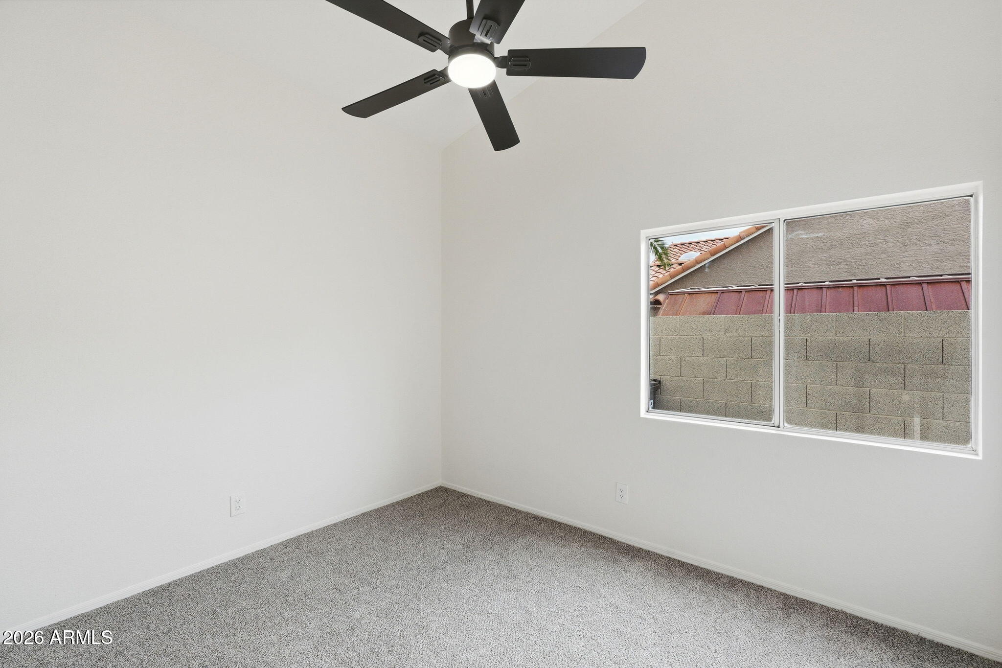 7756 West Hearn Road Peoria, AZ 85381 - Photo 28 of 41 an empty room with a window