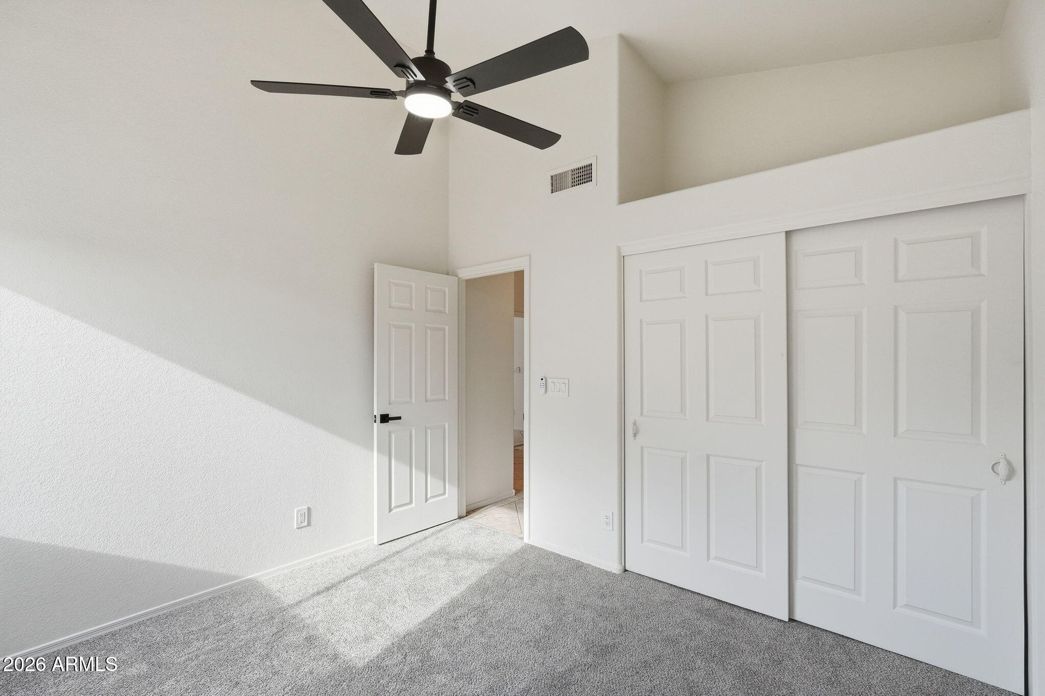 7756 West Hearn Road Peoria, AZ 85381 - Photo 29 of 41 an empty room with fan