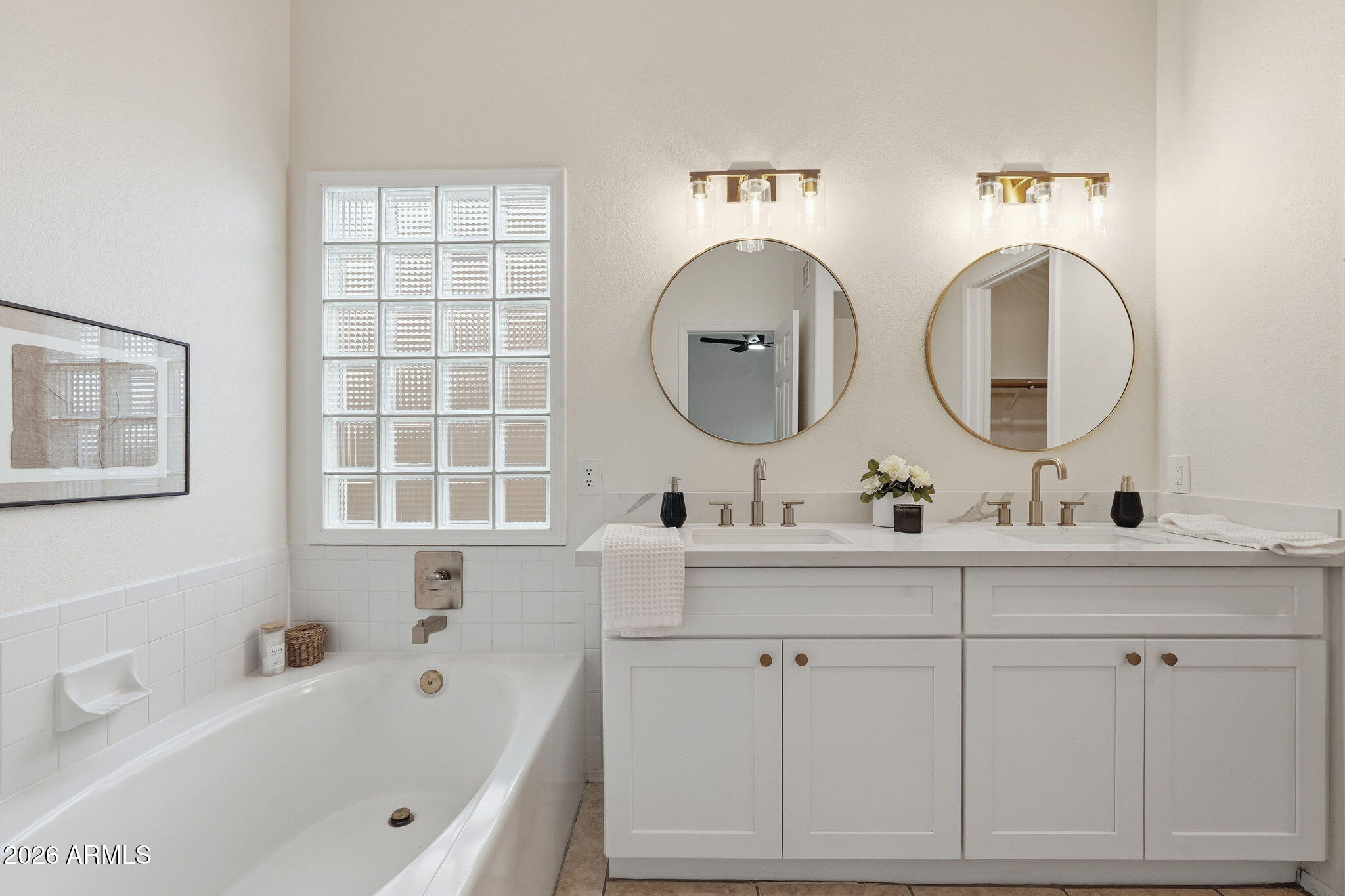 7756 West Hearn Road Peoria, AZ 85381 - Photo 31 of 41 a bathroom with a tub sink and mirror