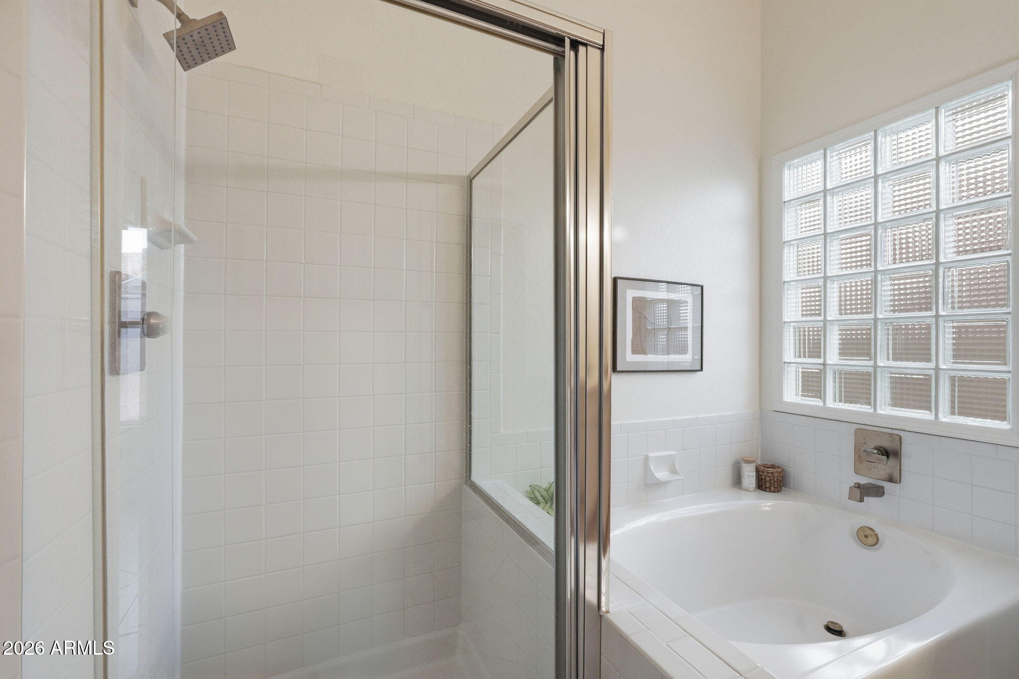 7756 West Hearn Road Peoria, AZ 85381 - Photo 32 of 41 a white bath tub sitting next to a window
