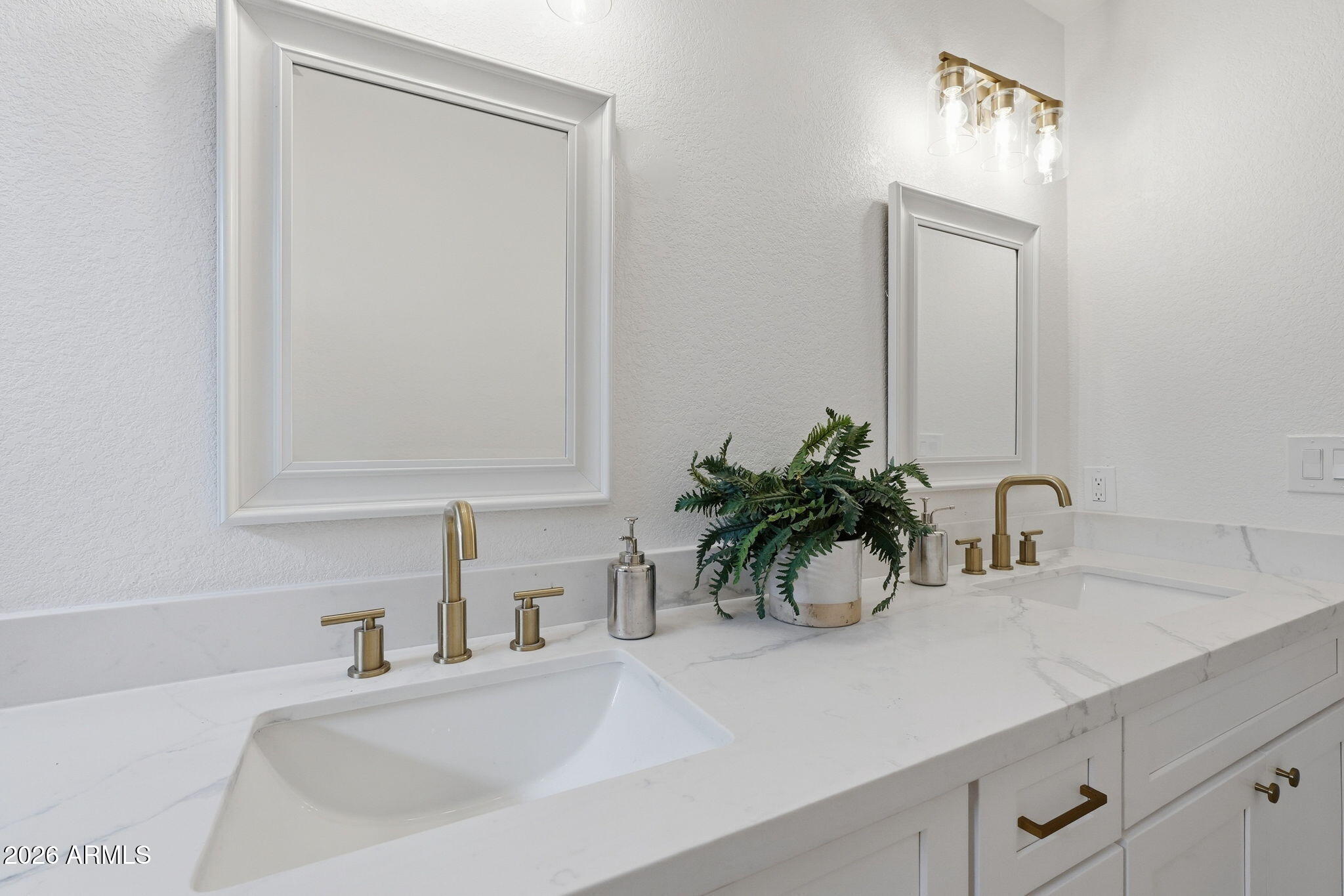 7756 West Hearn Road Peoria, AZ 85381 - Photo 33 of 41 a bathroom with a sink a vanity and a mirror