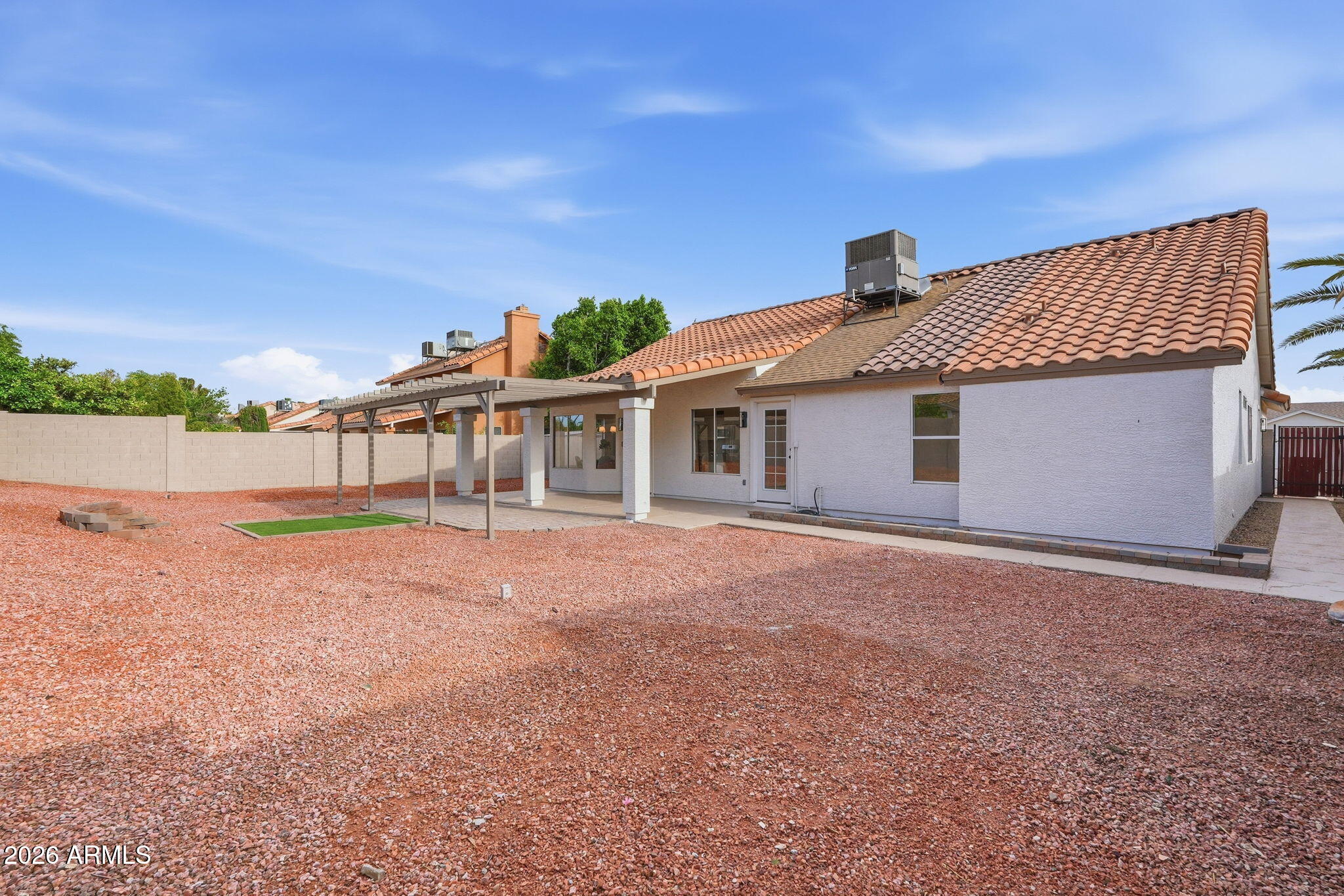 7756 West Hearn Road Peoria, AZ 85381 - Photo 38 of 41 a front view of a house with a yard and garage