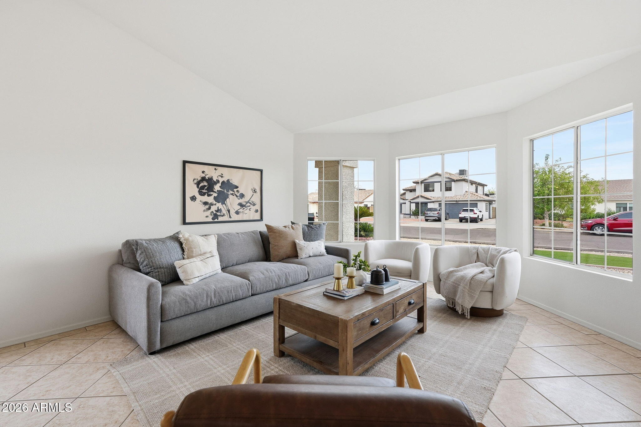 7756 West Hearn Road Peoria, AZ 85381 - Photo 7 of 41 a living room with furniture and a large window