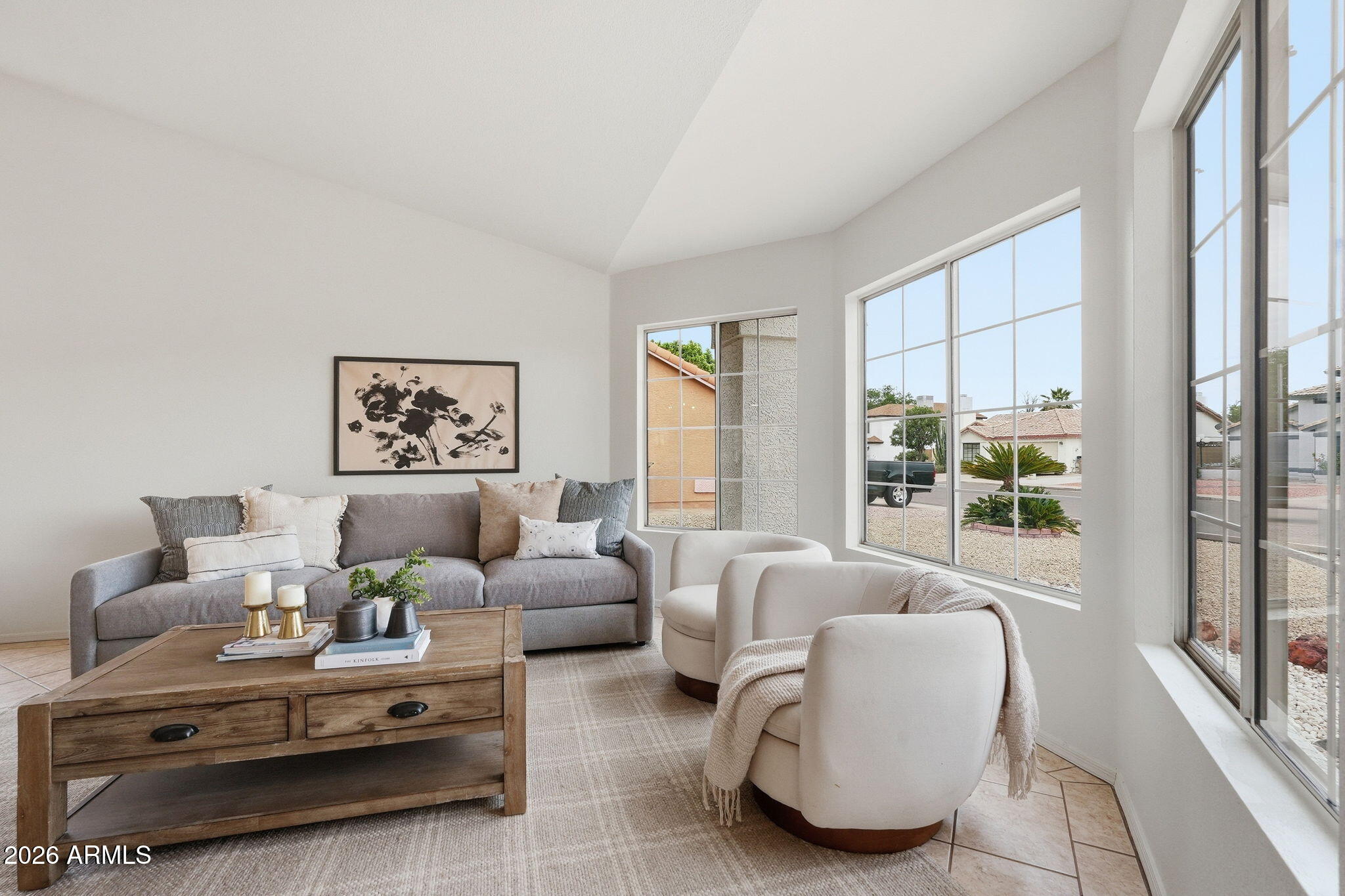 7756 West Hearn Road Peoria, AZ 85381 - Photo 8 of 41 a living room with furniture and a large window