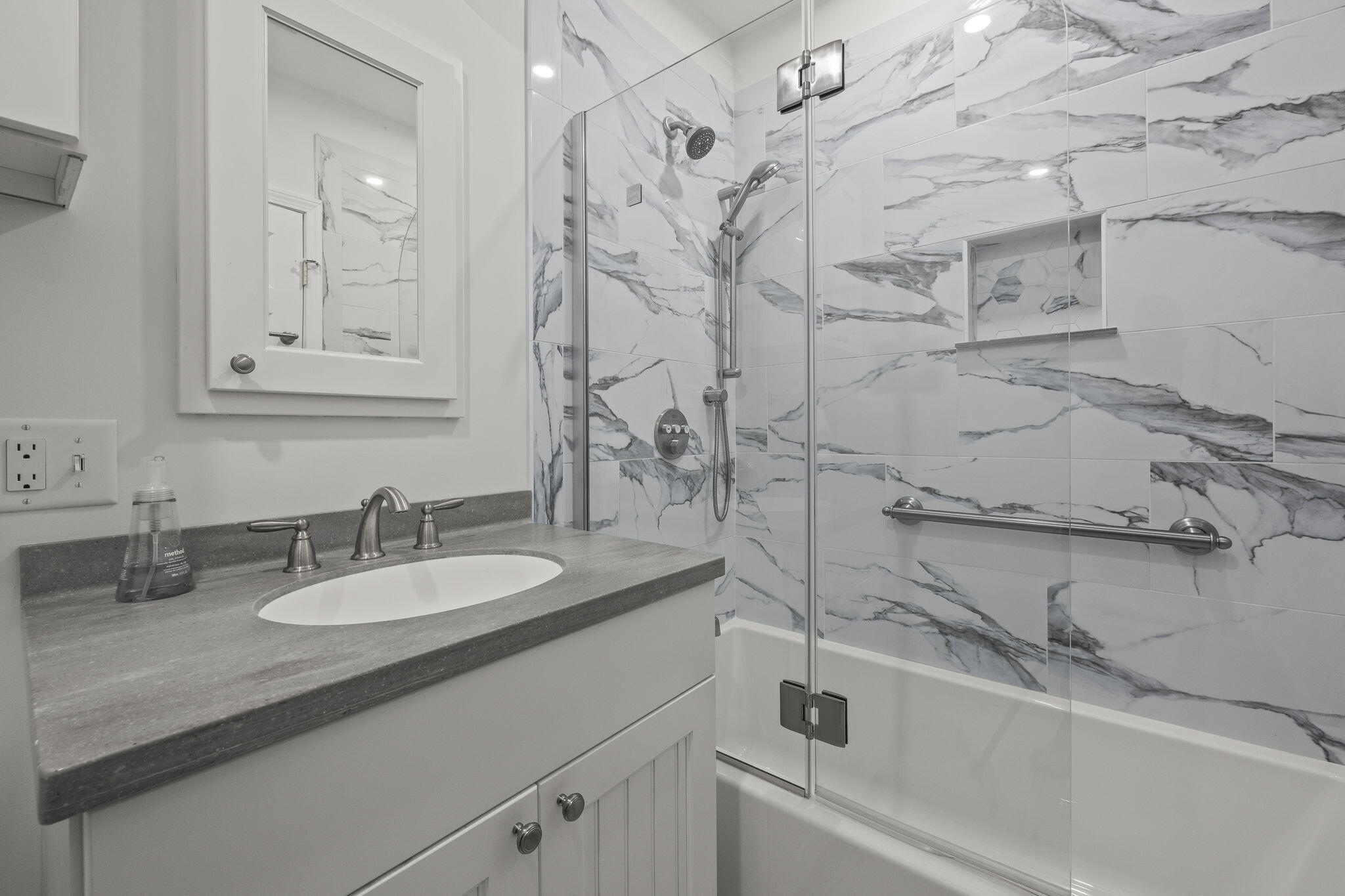 552 Orleans Road North Chatham, MA 02650 - Photo 21 of 31 a bathroom with a sink vanity granite tub and a mirror