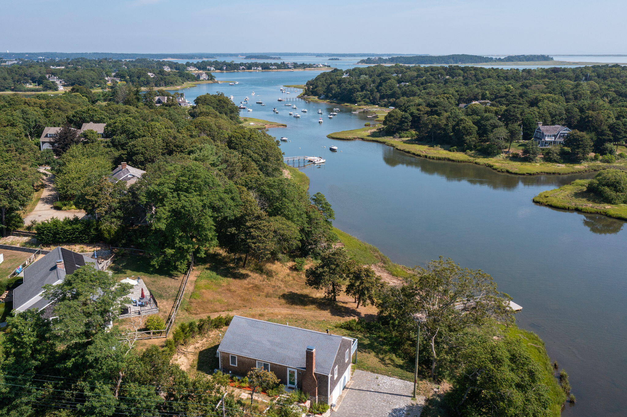 552 Orleans Road North Chatham, MA 02650 - Photo 3 of 31 an aerial view of a house with a lake view