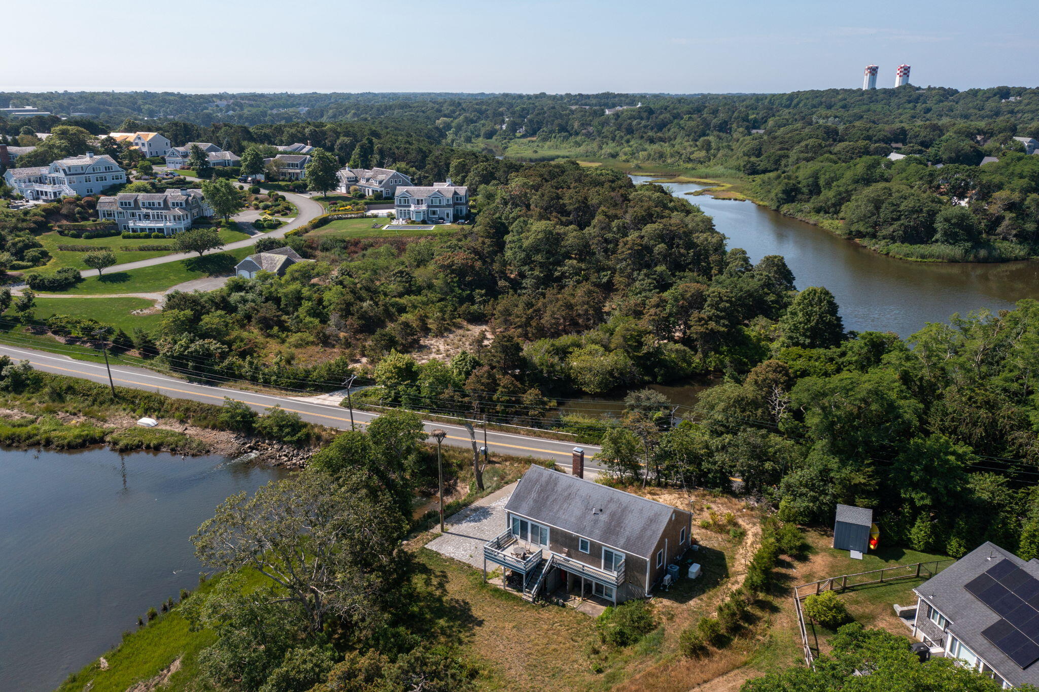552 Orleans Road North Chatham, MA 02650 - Photo 4 of 31 an aerial view of a house with a garden and lake view